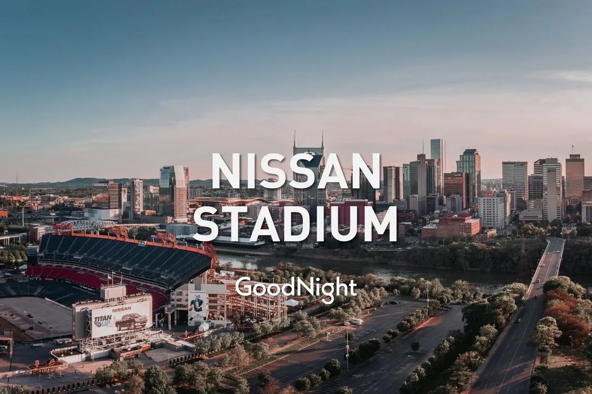 A dynamic exterior shot featuring Nissan Stadium, the city skyline, and the river, capturing the energy of Nashville's sports and event scene. The stadium is prominent, with the city stretching out behind and the river in the foreground, suggesting easy access to major venues.