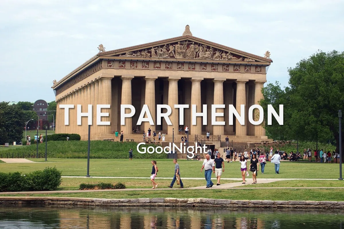 A wide view of The Parthenon set within a lush park, with families and other visitors walking around the iconic structure. The surrounding greenery and open space evoke a sense of leisure, culture, and educational exploration in a communal setting.
